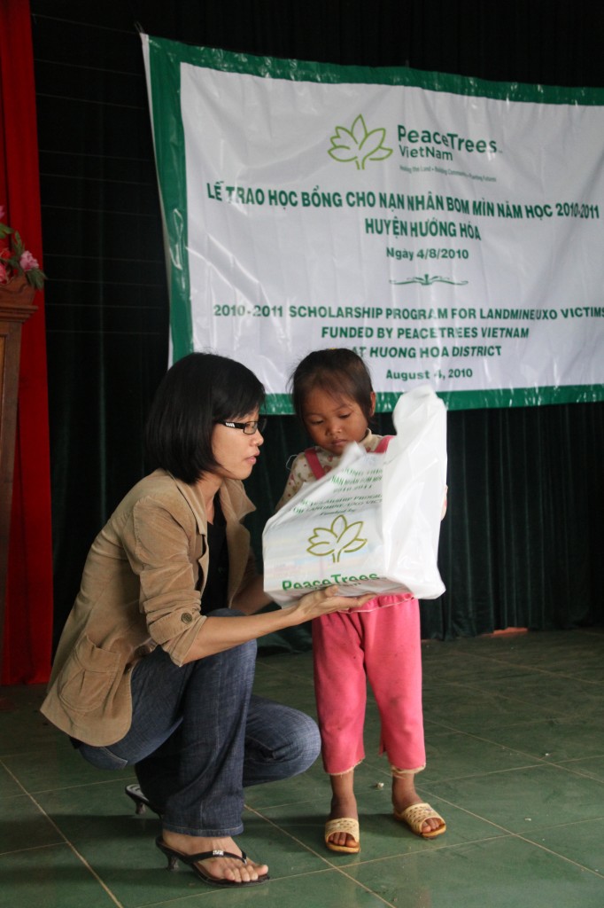 Kieu accepts her school supplies for first grade