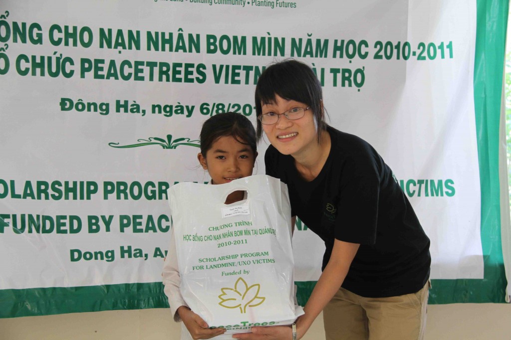 Xinh receives his scholarship from PeaceTrees Vietnam